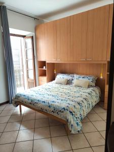 Posteľ alebo postele v izbe v ubytovaní Bilocale Vecchio Borgo