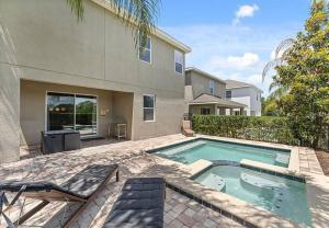 a swimming pool in front of a house at 371 P Luxury Villa- New Listing in Orlando
