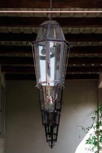 a glass light fixture hanging from a ceiling at Casale Hortensia in Reggio Emilia