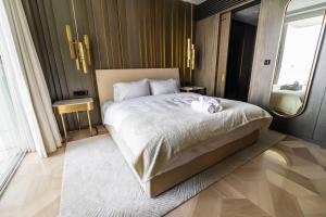 Postel nebo postele na pokoji v ubytování FIVE Palm South Residence - Vacationer