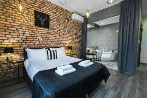 Posteľ alebo postele v izbe v ubytovaní Leo Apartments Old Town