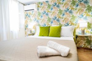 A bed or beds in a room at Casa Carmine - Taormina Centro