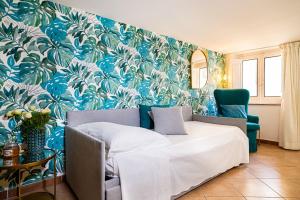 A bed or beds in a room at Casa Carmine - Taormina Centro