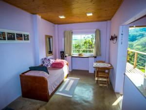 Postel nebo postele na pokoji v ubytování Hospedagem Terra de Aquários