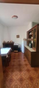 a kitchen with a table and a dining room at Teulada vacanze in Teulada