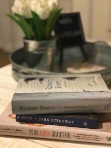 drie boeken bovenop elkaar op een tafel bij Sunny Roost * Hot Tub * Pool * Views * Snow Canyon in Ivins
