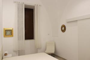 Postel nebo postele na pokoji v ubytování B&b Bianco Apartments