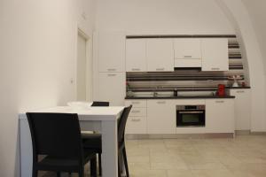 Kuchyň nebo kuchyňský kout v ubytování B&b Bianco Apartments