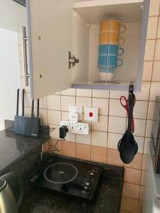 a kitchen with a counter with a utensil and a sink at Studio apartment in the heart of Dubai Marina. in Dubai