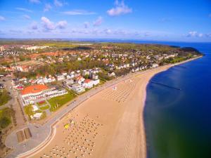 an aerial view of a beach with a group of people at ATLANTIC Grand Hotel Travemünde in Travemünde
