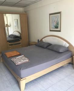 Postel nebo postele na pokoji v ubytování Jomtien Beach Condominium Rimhad A + 26 fotografií