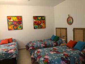 Posteľ alebo postele v izbe v ubytovaní ABA Tropical & ABA Suite