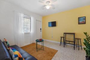 a living room with a couch and a table at Miami 1 Bedroom Apt With Parking in Miami