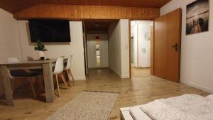 a living room with a table and a dining room at Apartment Silva in Kappel-Grafenhausen