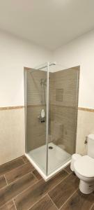 a shower stall in a bathroom with a toilet at Villa Fedelian 2 Playa Blanca in Playa Blanca