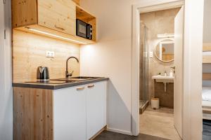 Kopalnica v nastanitvi Apartmány NONE