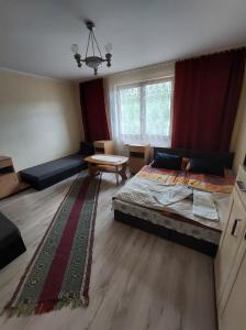 Posteľ alebo postele v izbe v ubytovaní Domek nad Potokiem