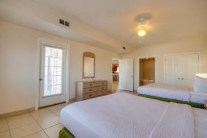 a large bedroom with two beds and a window at Americana Condos 10th street in Ocean City