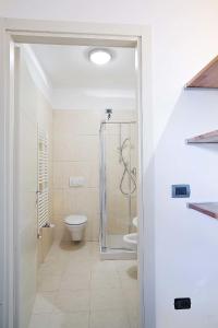 a bathroom with a shower and a toilet at Gioberti Suite in Florence