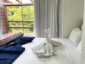Ein Bett oder Betten in einem Zimmer der Unterkunft Villas do Pratagy Maceió