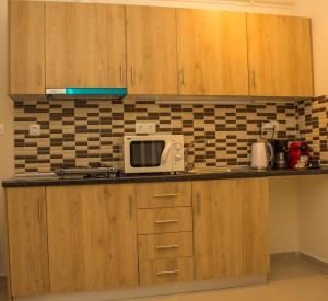 Kuchyň nebo kuchyňský kout v ubytování Central Luxury Studio 2
