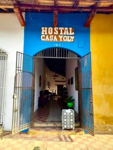 a building with a sign that reads hospital casa yoren at Casa Yoly Hostel Granada in Granada