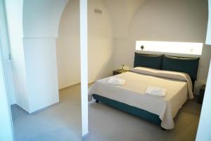 a bedroom with a bed in a room at Miro Luxury Home in San Vito dei Normanni
