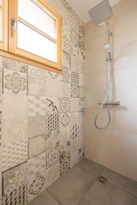 a bathroom with a shower and a window at Talloires Village, Lac d'Annecy, Résidence récente 4 étoiles in Talloires +22 photos
