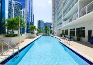 a swimming pool in the middle of a building at Exquisite Ocean View 3 BR Apartment in Miami