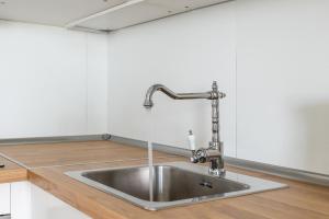 a stainless steel sink in a kitchen at Flamingo Apartment on the south near the beach in Palm-mar +26 photos
