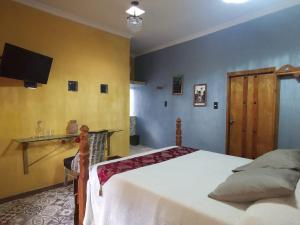 Postel nebo postele na pokoji v ubytování Hotel Tihosuco Colonial
