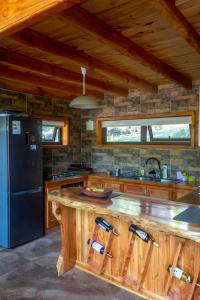 A kitchen or kitchenette at The GreeNest Lodge