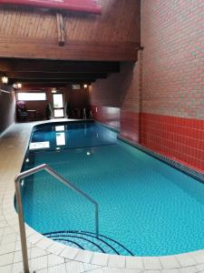 a large swimming pool in a building at The Royal Lion Hotel in Lyme Regis