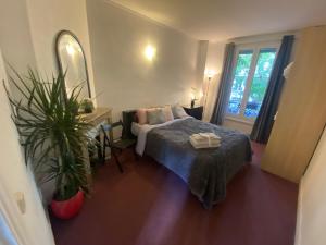 Posteľ alebo postele v izbe v ubytovaní Trendy 2 Rooms Paris 13