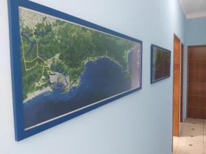 a large picture of a map on a wall at Casa Temporada Bertioga- Indáia in Bertioga