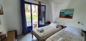 A bed or beds in a room at Irini Studios