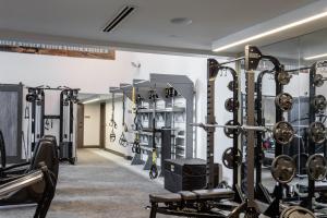 a gym with several rows of weight machines at Locale Music Row - Nashville in Nashville