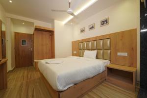 Postel nebo postele na pokoji v ubytování Southern Residency