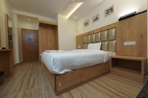 Postel nebo postele na pokoji v ubytování Southern Residency