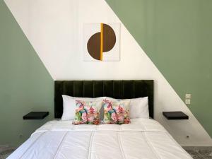 a bedroom with a large bed with a black headboard at Cosy appartement Next to Majorelle Garden in Marrakech