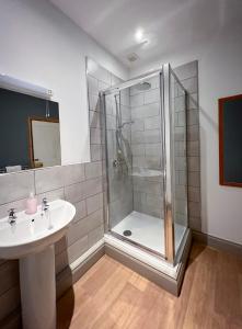 a bathroom with a shower and a sink at New Ing Lodge in Shap