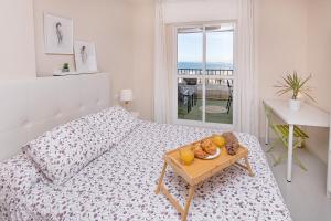 A bed or beds in a room at Sunshine Balcony- La Caleta Még 24 kép