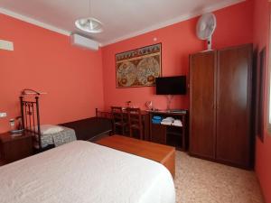 Postel nebo postele na pokoji v ubytování B&B Falcone
