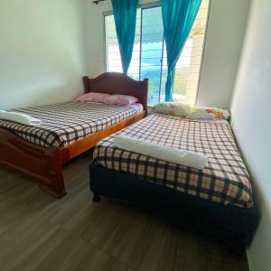 Кровать или кровати в номере Finca Villa Anita Moniquirá Boyacá