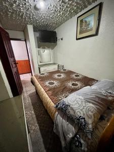 Postel nebo postele na pokoji v ubytování Hostal Carlos Luis
