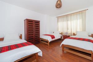 Postel nebo postele na pokoji v ubytování Napolitano Apart Hotel