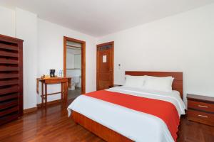 Postel nebo postele na pokoji v ubytování Napolitano Apart Hotel