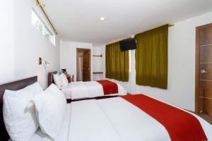 Postel nebo postele na pokoji v ubytování Napolitano Apart Hotel