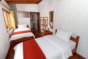 Postel nebo postele na pokoji v ubytování Napolitano Apart Hotel