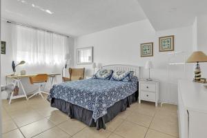 a bedroom with a bed and a desk and a table at THE TIDES 2bedrooms apt 14th floor WE ARE ON THE BEACH! in Hollywood